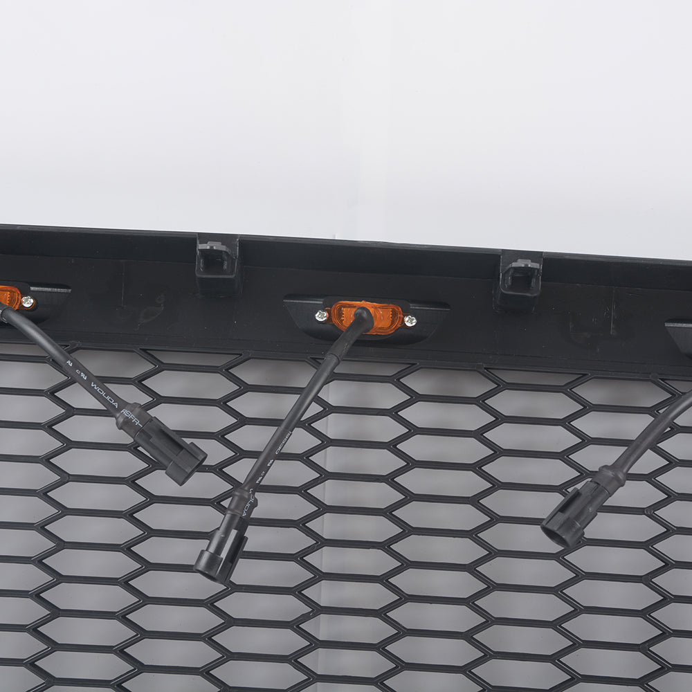 Black honeycomb grill with integrated amber LED lights for automotive customization