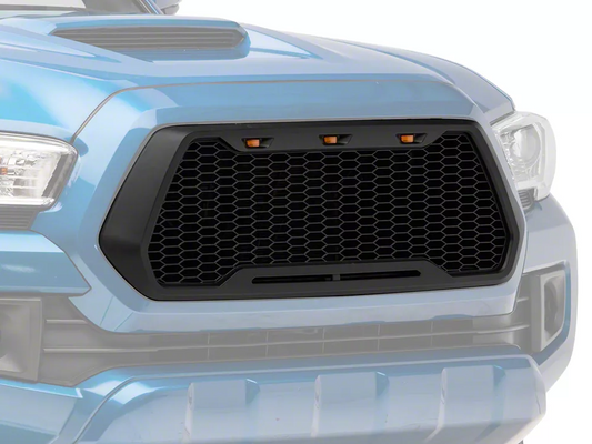 Black honeycomb truck grille with amber accent lights