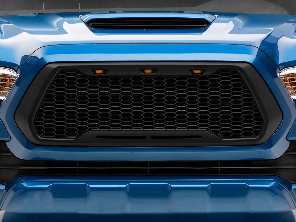 Blue truck with honeycomb grille and amber marker lights