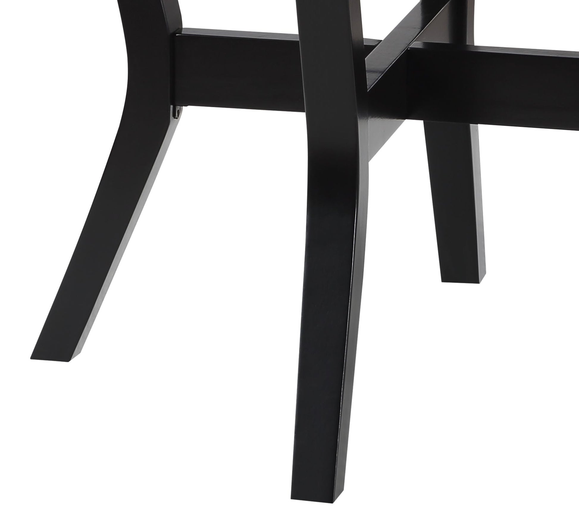 Closeup of black wooden dining chair legs with angled feet