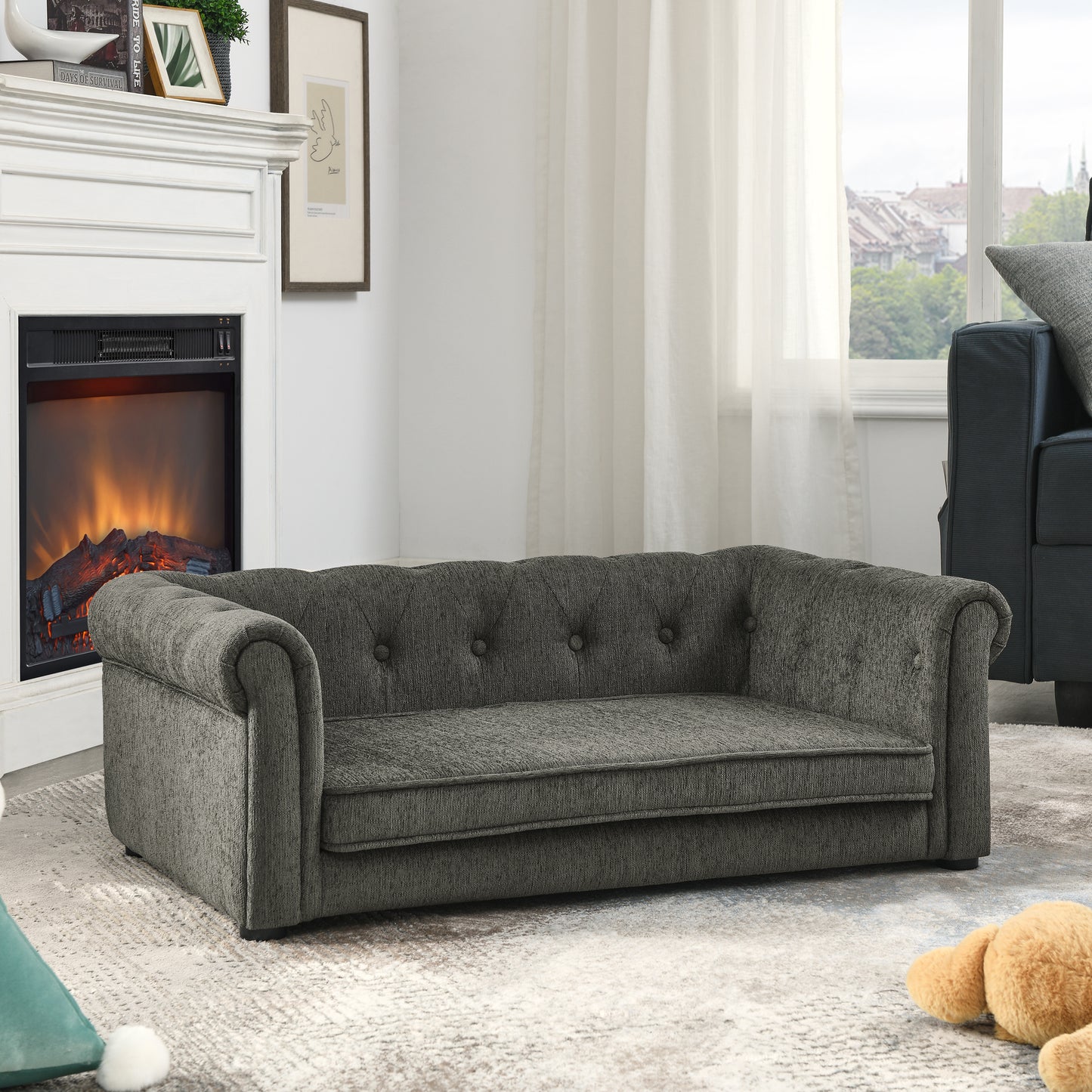 Gray tufted pet sofa with rolled arms and button detailing