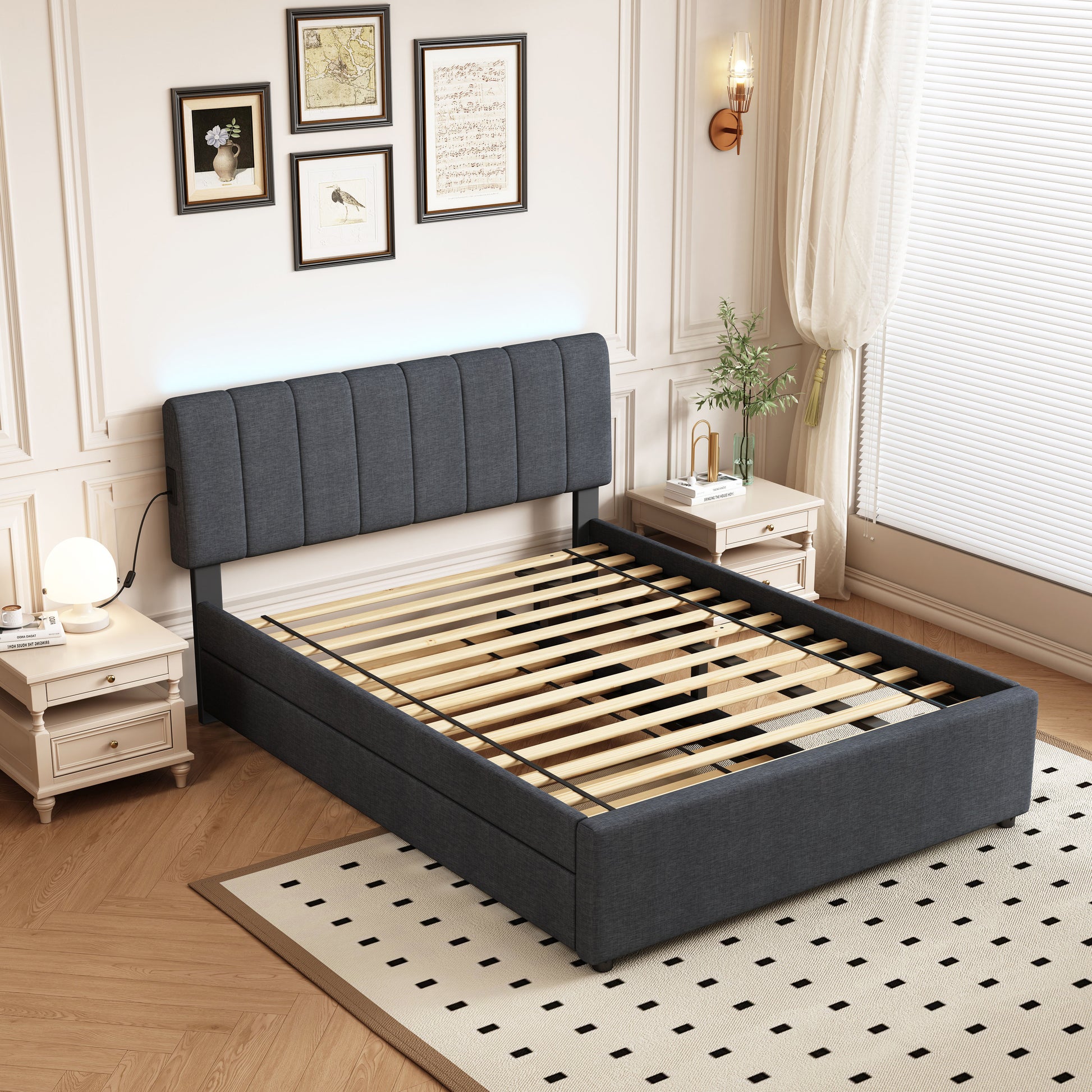 Dark grey upholstered platform bed with vertical stitching on the headboard and wooden slats