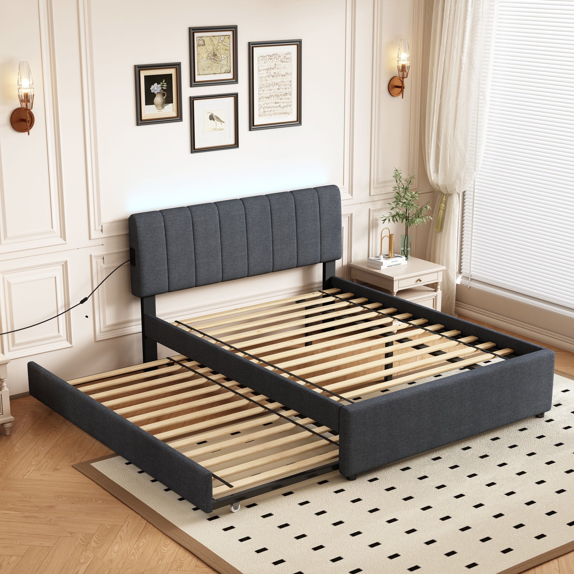 Dark gray upholstered trundle bed frame with wooden slats