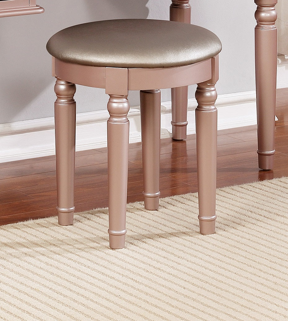 Rose gold upholstered vanity stool with turned legs
