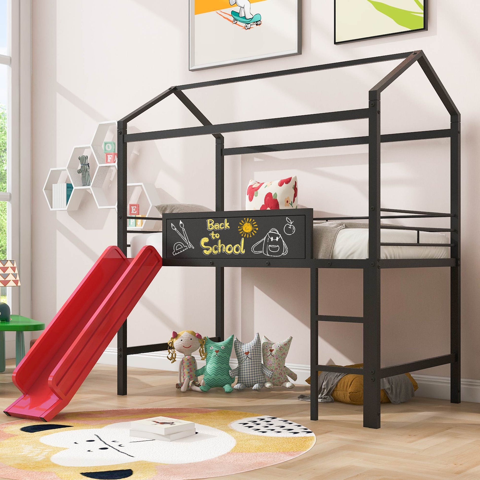 Black metal loft bed with red slide and playful pillows