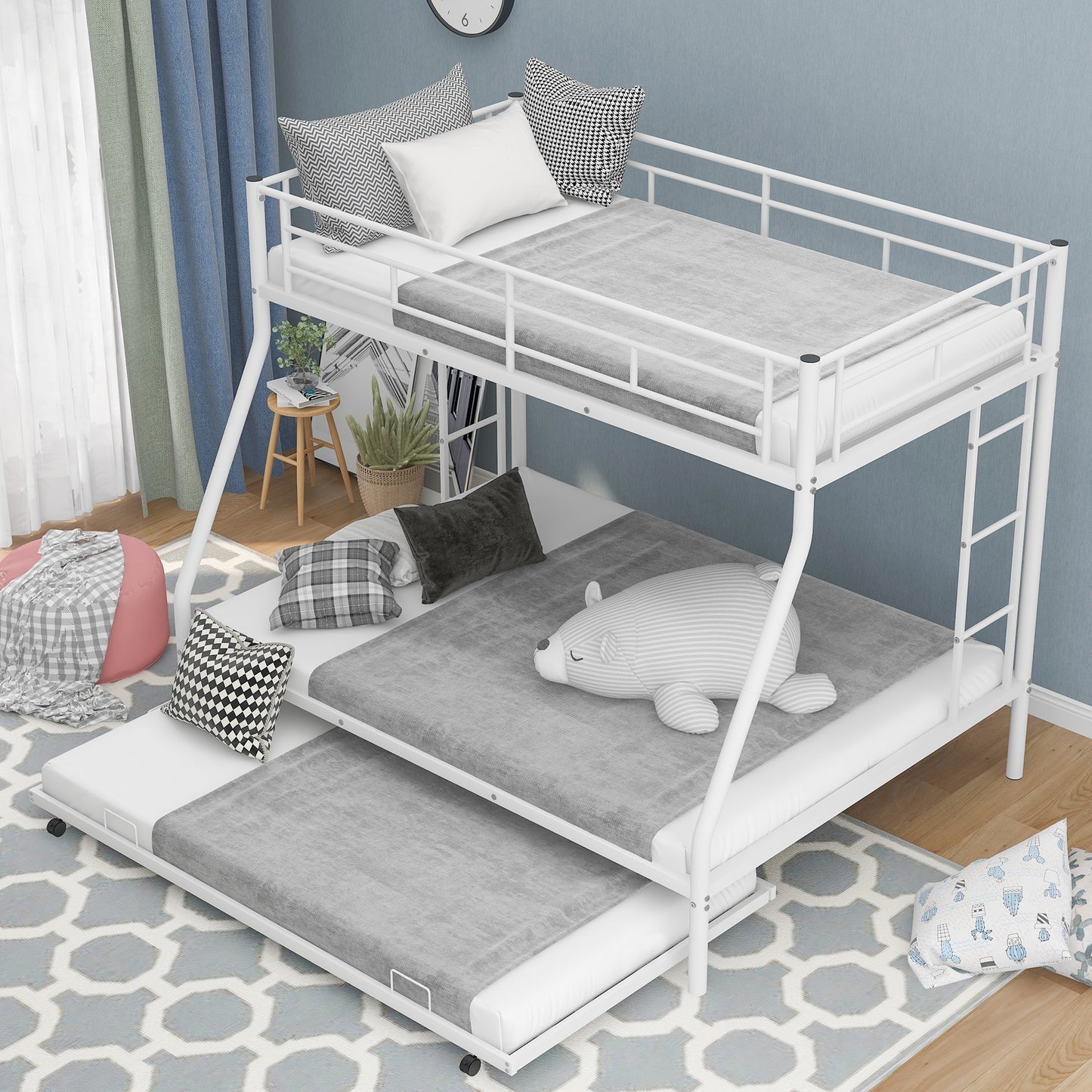 White metal triple bunk bed with pullout trundle gray bedding and decorative pillows