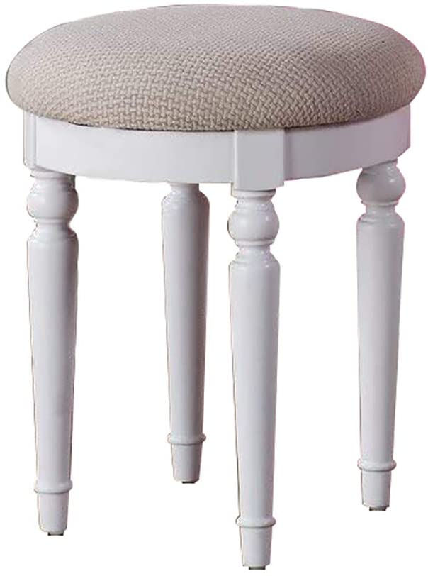 White upholstered vanity stool with turned legs