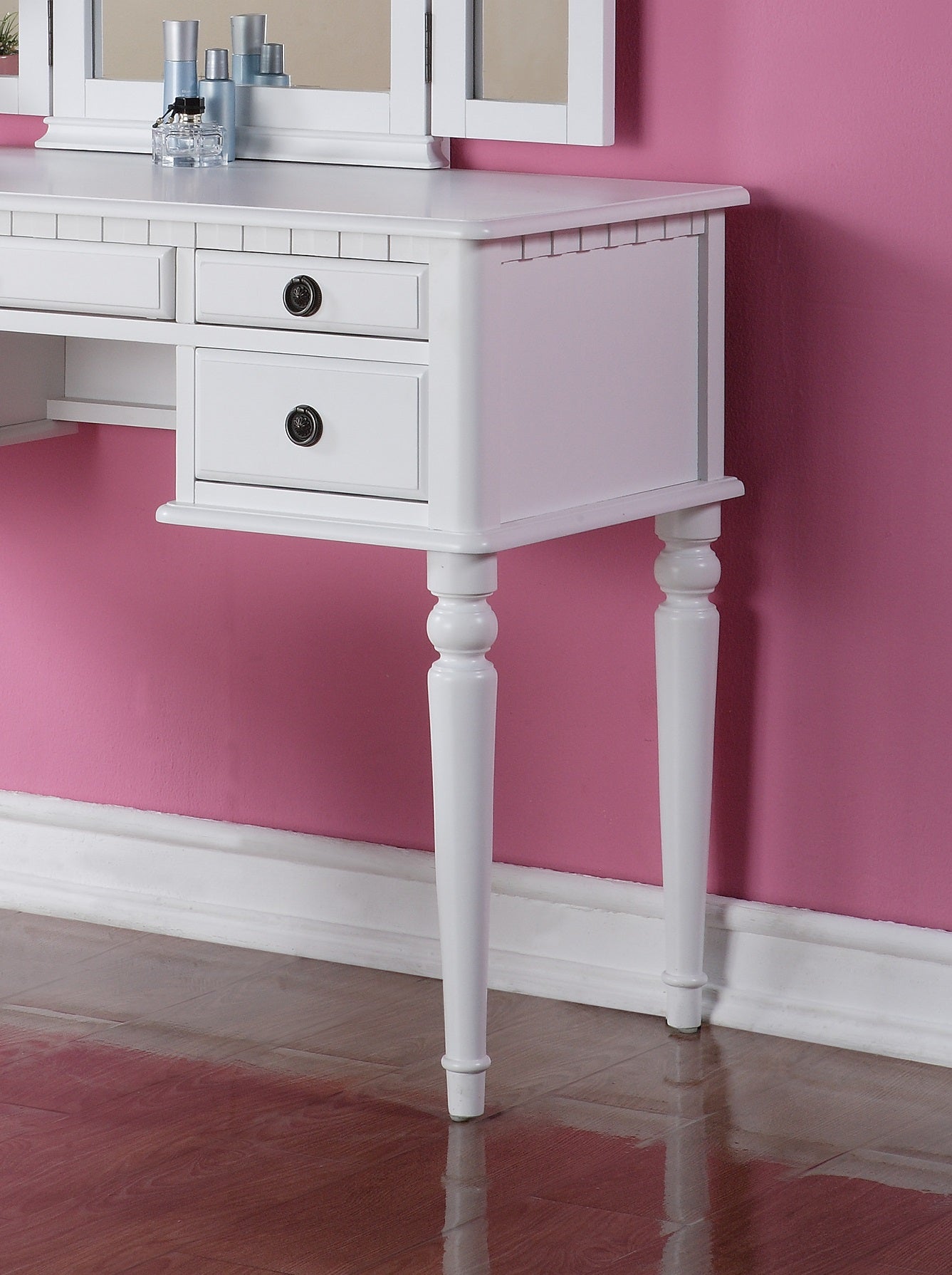 White vanity desk with carved legs and dark knob drawers