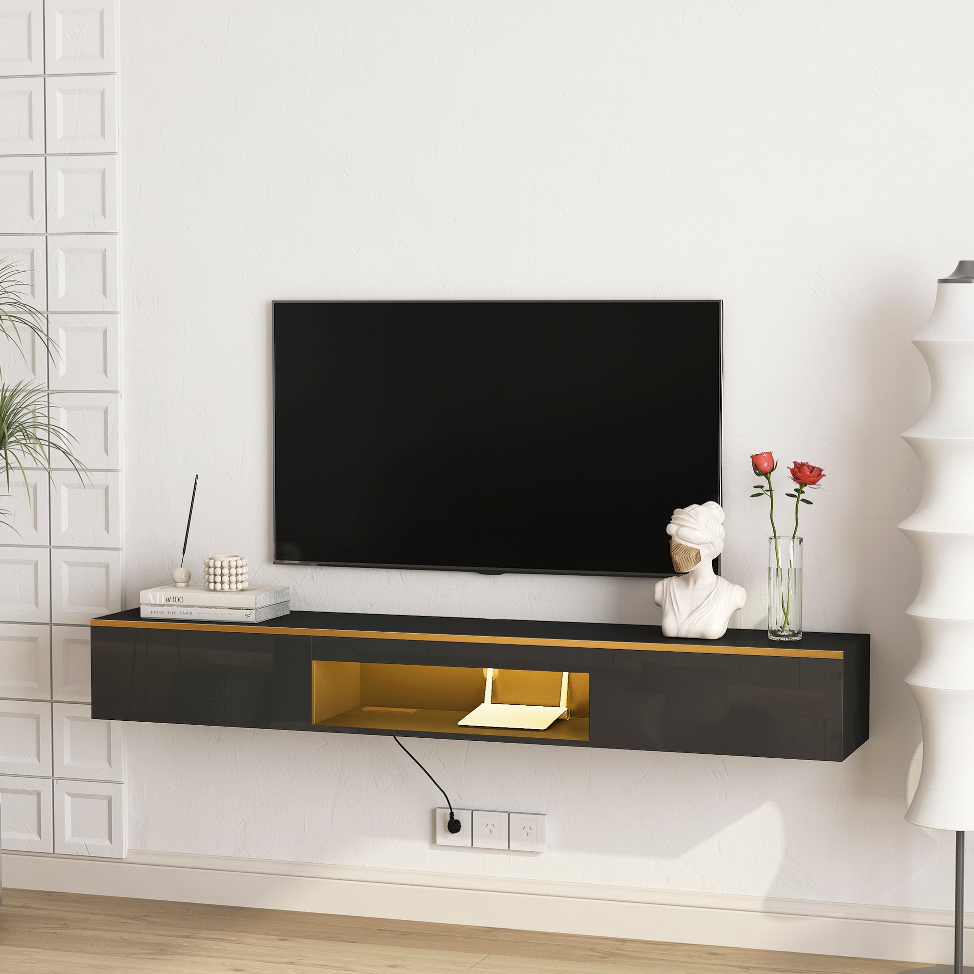 Floating media console in dark gray with gold accents ideal for modern living rooms