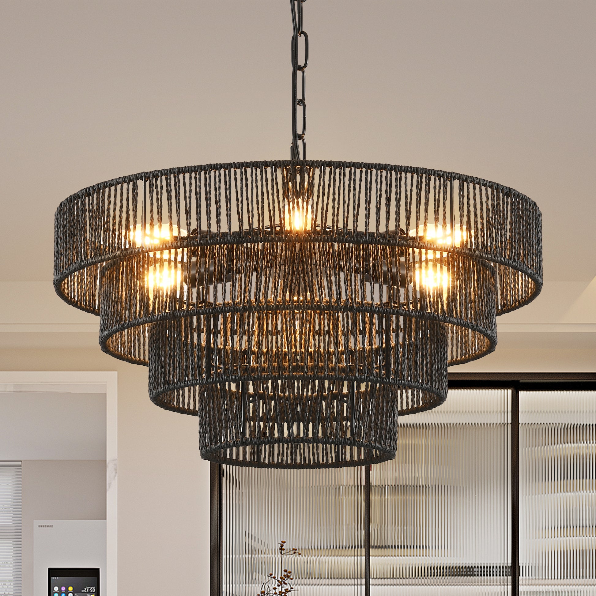 Multitiered black rope chandelier with exposed bulbs illuminates dining spaces