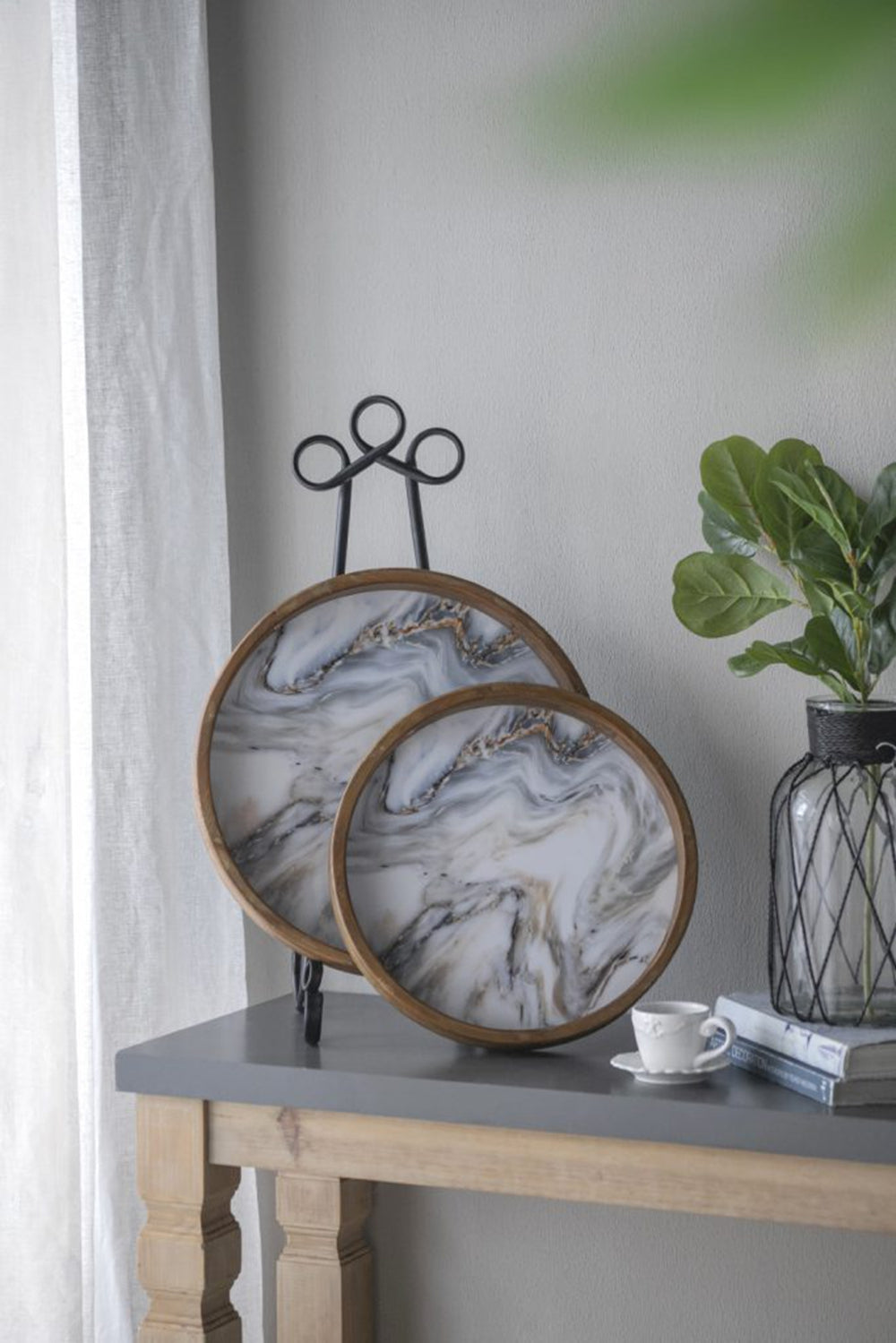 Set of  round decorative trays with wood trim and marbled gray and gold pattern