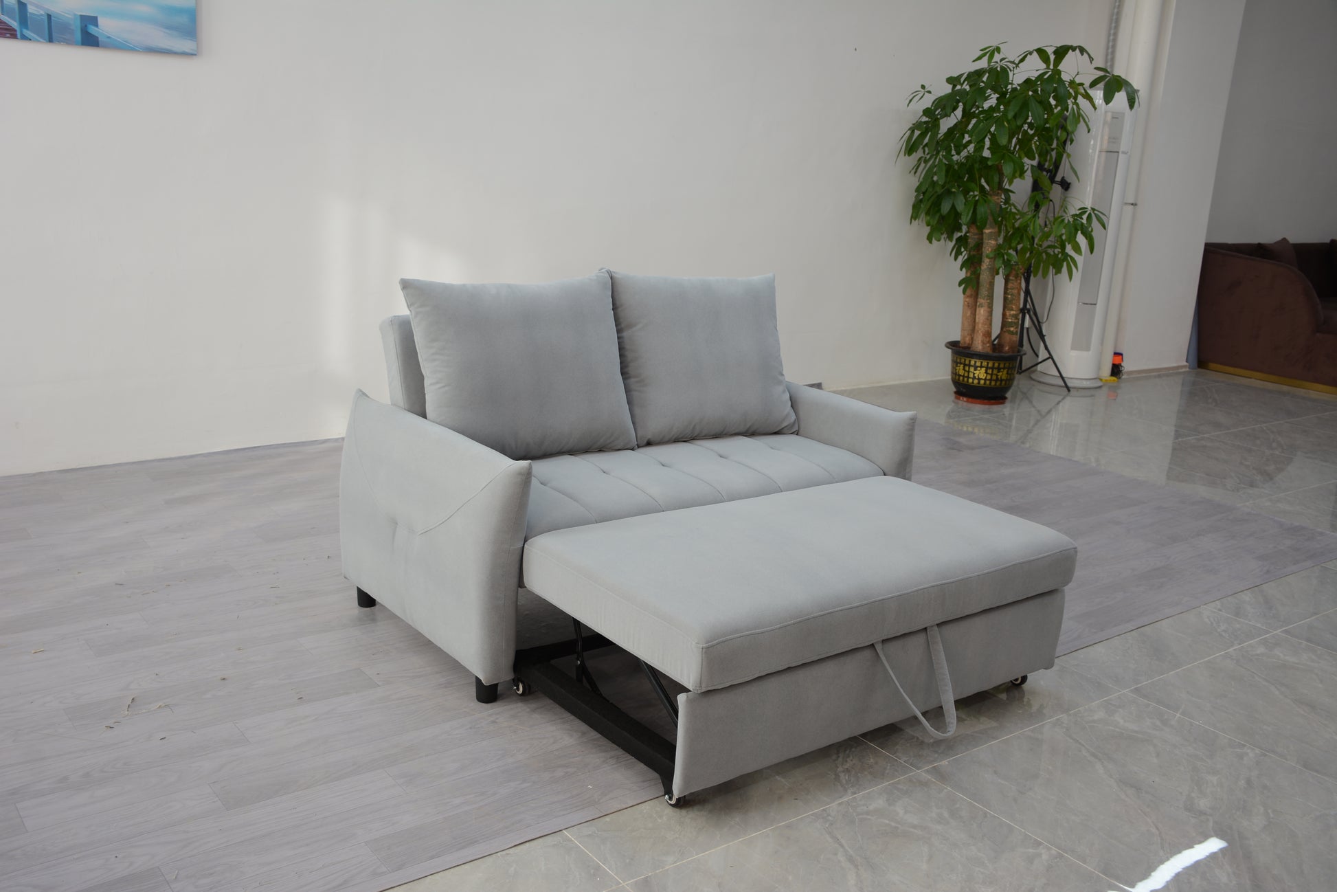 Gray velvet sofa bed with pullout ottoman and storage modern furniture piece