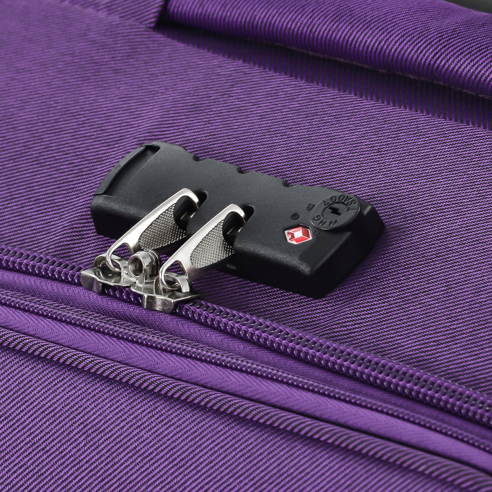 Purple fabric suitcase with TSA combination lock detail