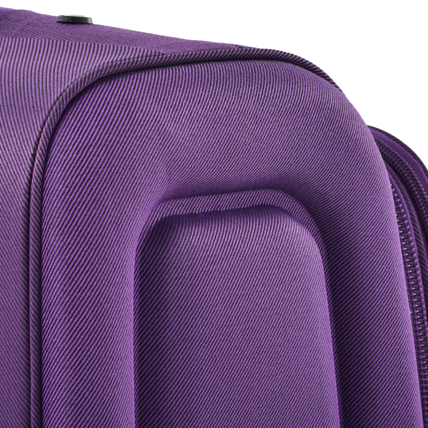 Close up of purple textured fabric on a rolling suitcase with a black pull handle
