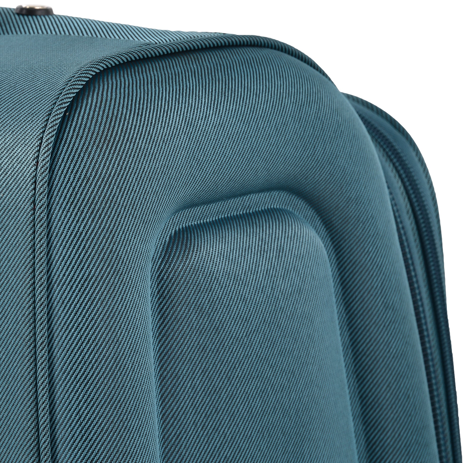 Closeup of teal luggage fabric with ribbed texture and padded design
