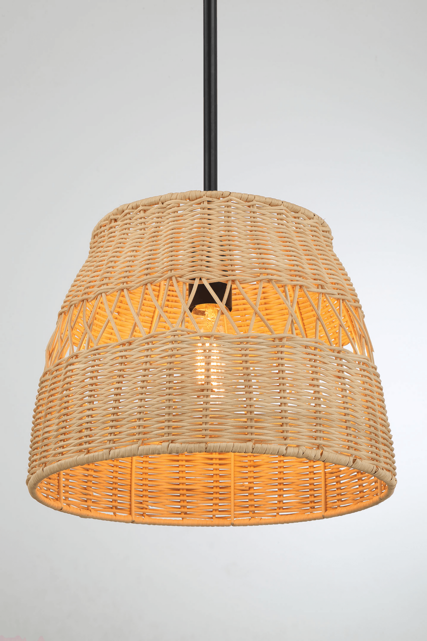Natural woven rattan pendant light with visible filament bulb for a cozy ambiance