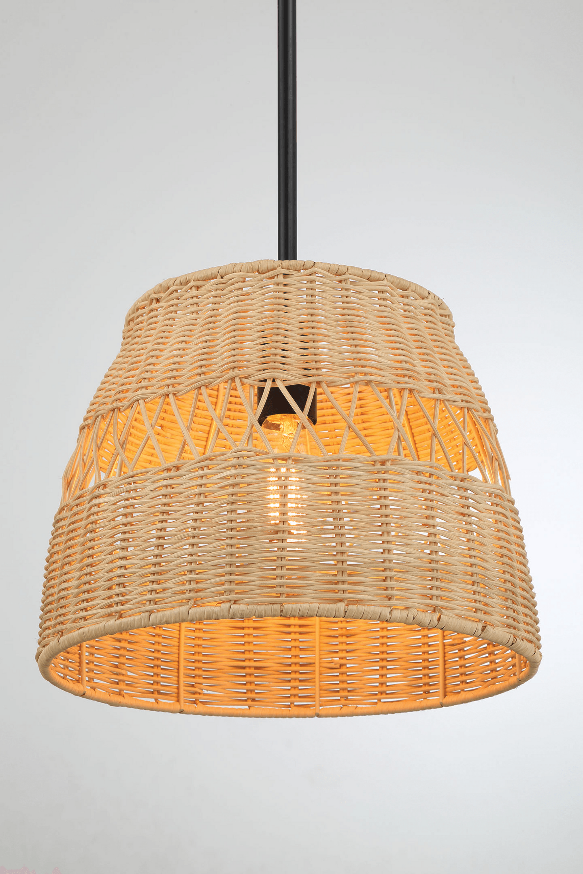 Natural woven rattan pendant light with visible filament bulb for a cozy ambiance