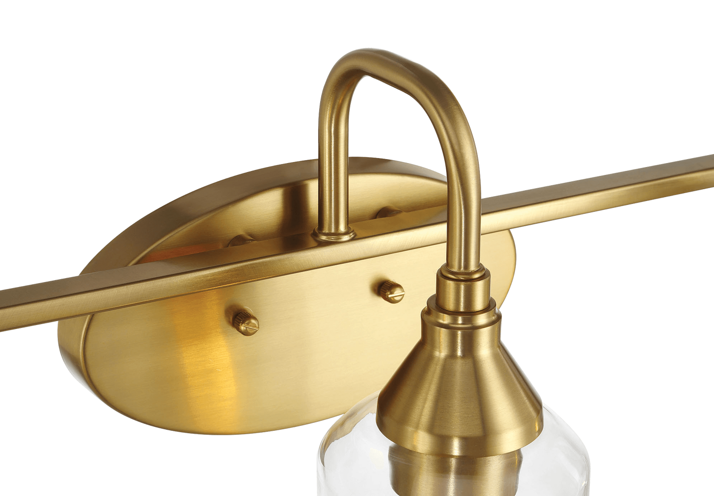Close up of brushed brass finish vanity light fixture with glass shade