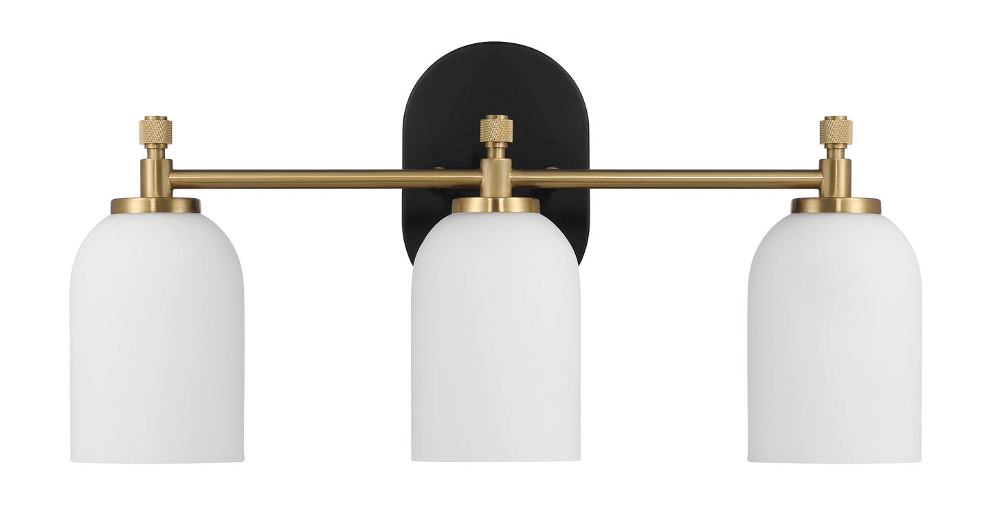 Modern brass vanity light with three white globe shades ideal for bathrooms