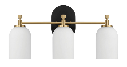 Modern brass vanity light with three white globe shades ideal for bathrooms