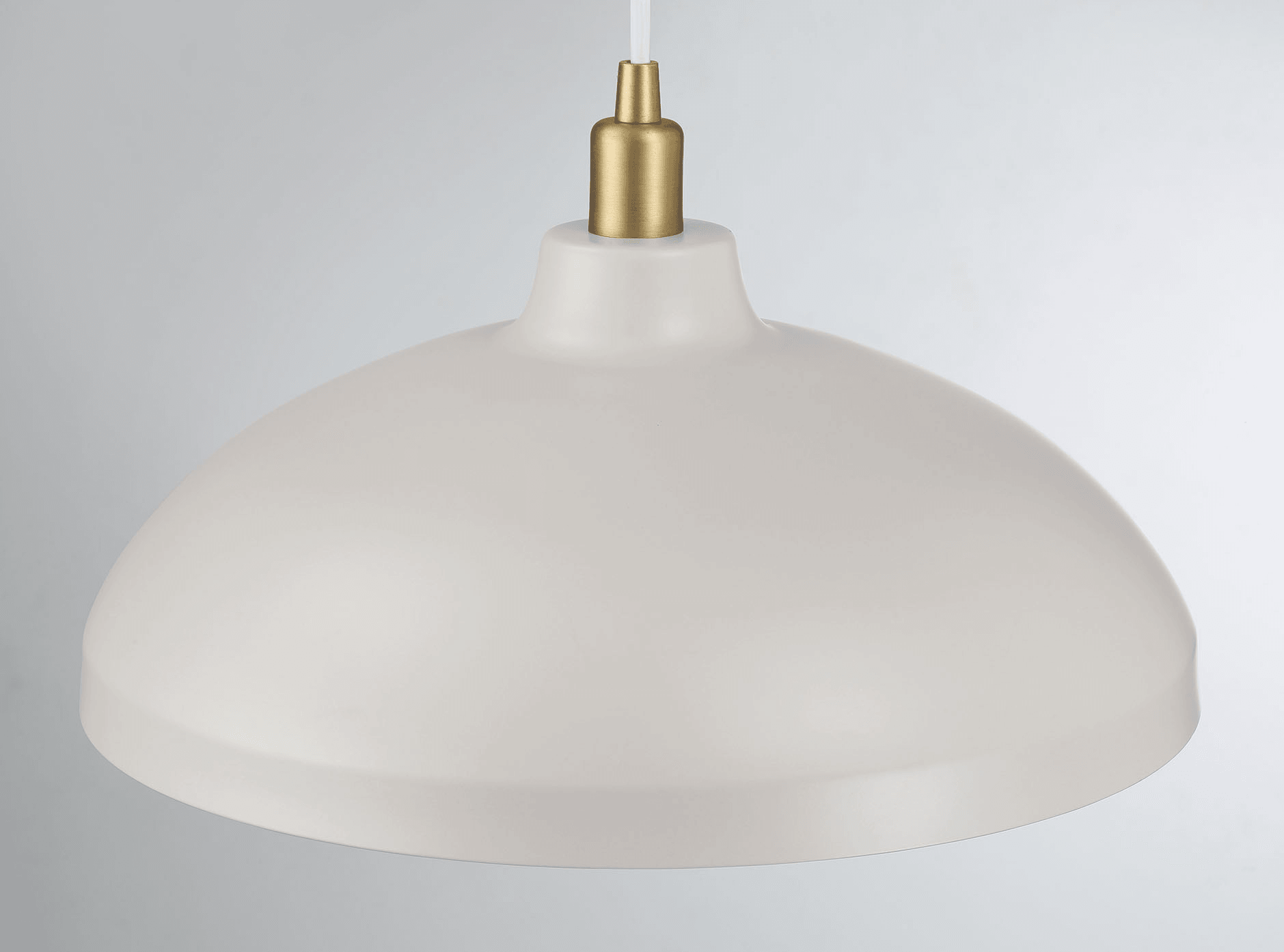 Cream farmhouse pendant light with brass accents ideal for kitchen island lighting