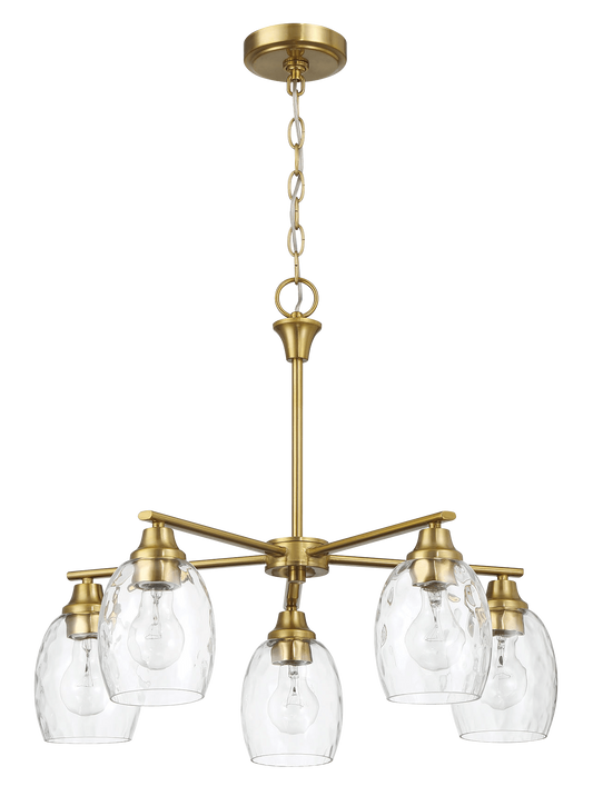 Brass chandelier with five clear textured glass shades providing elegant overhead lighting