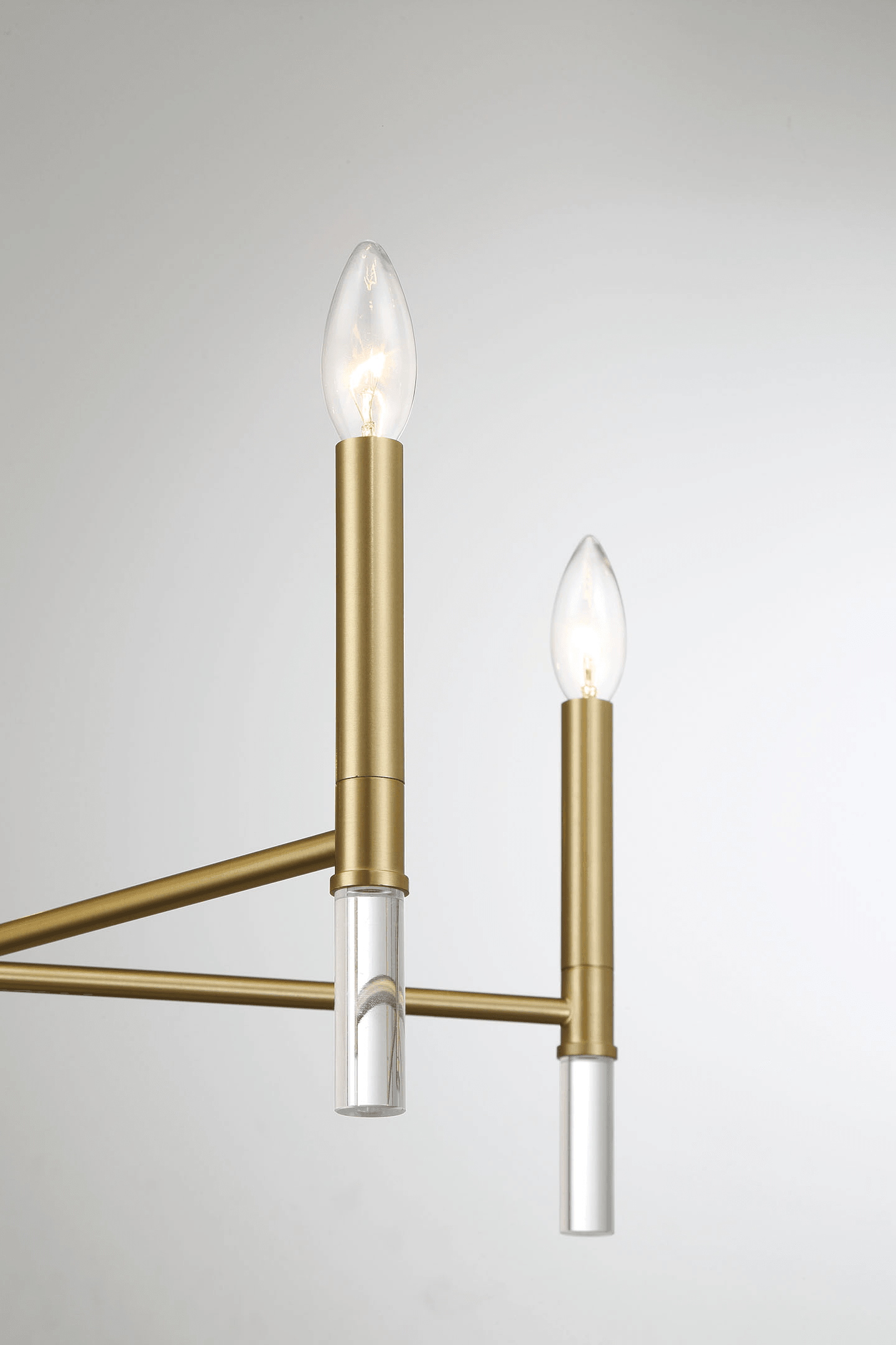 Modern brass chandelier with clear crystal accents and candelabra bulbs