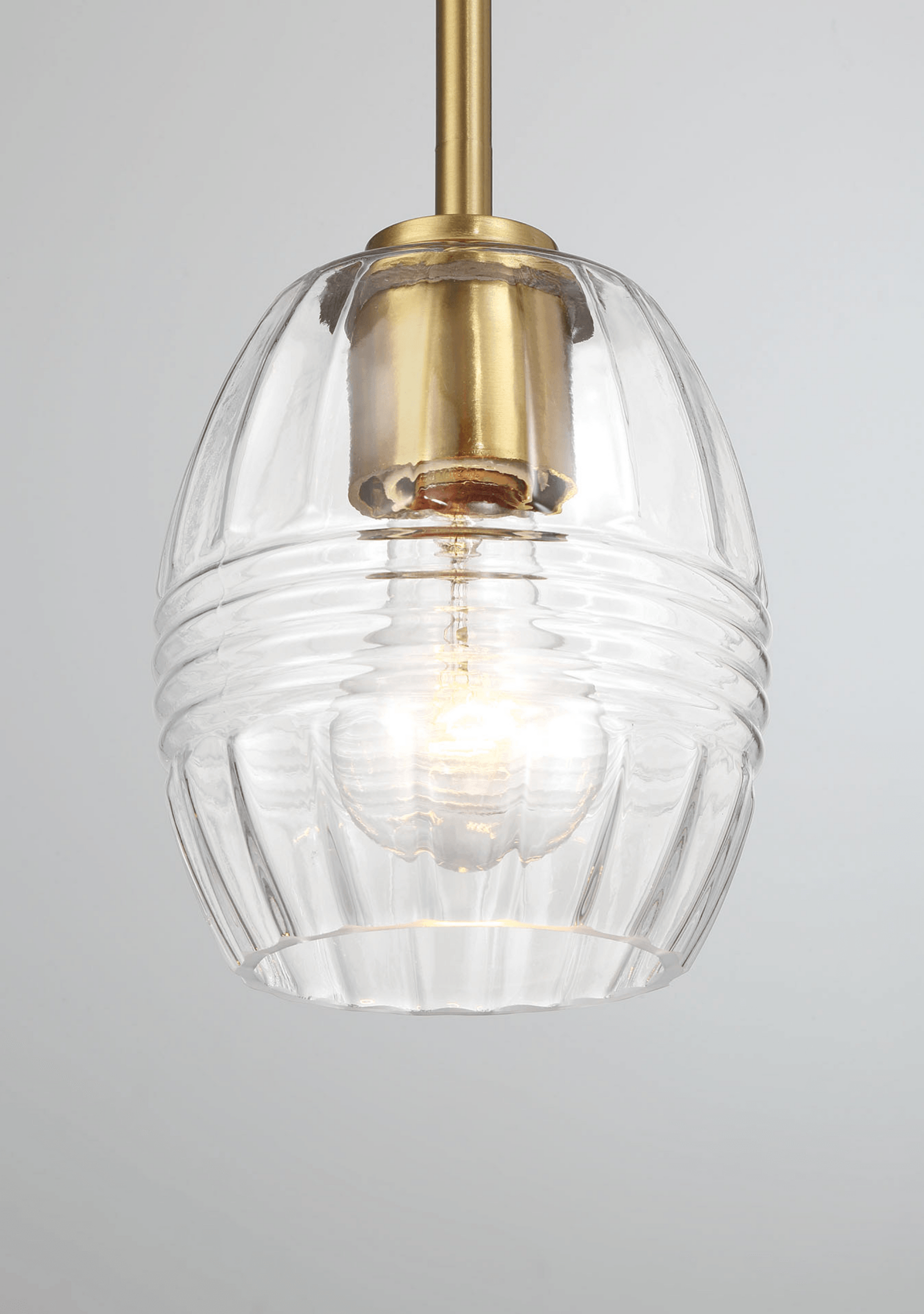 Clear glass ribbed pendant light with brass hardware modern design