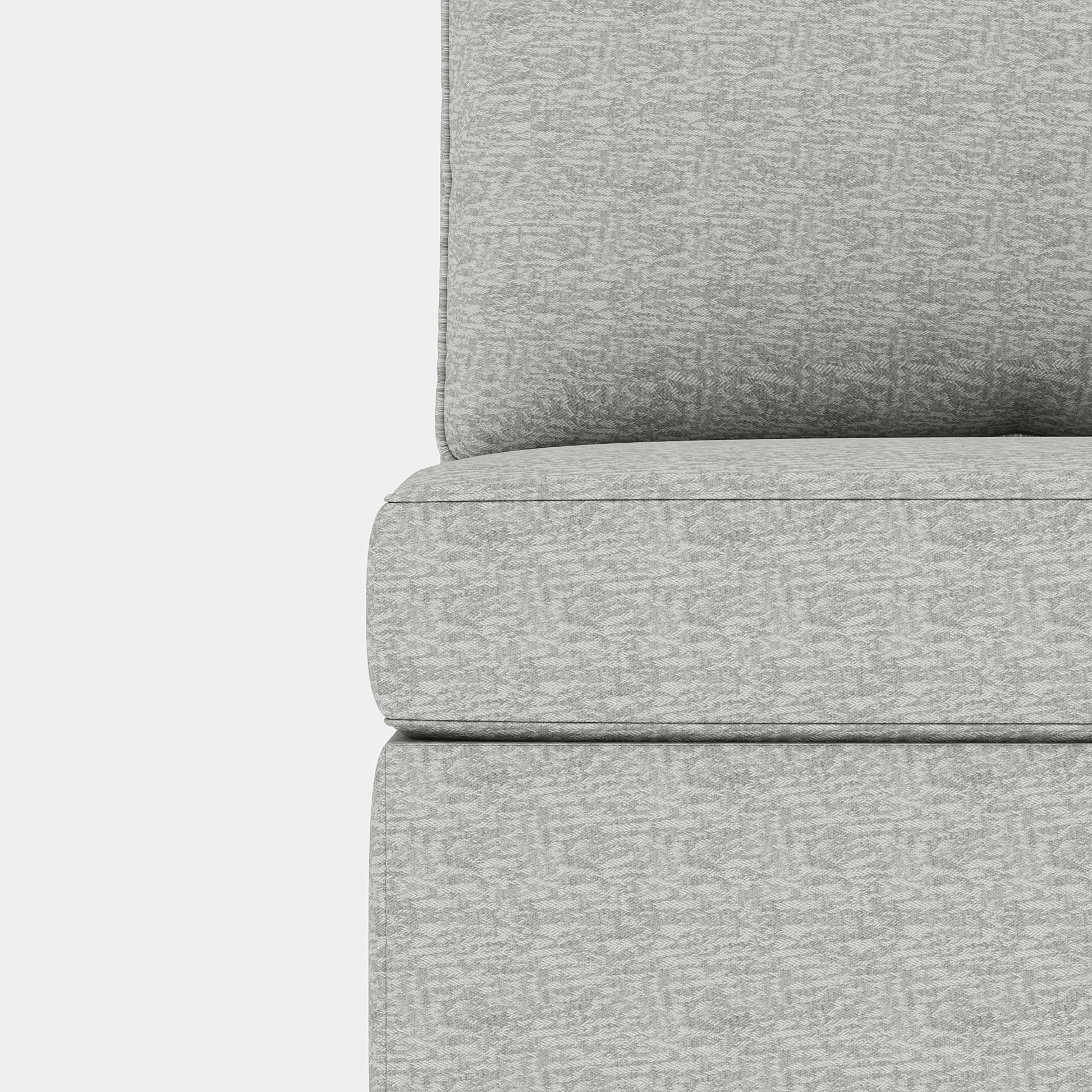 Closeup of a modern sofas textured grey fabric upholstery showing its detailed weave
