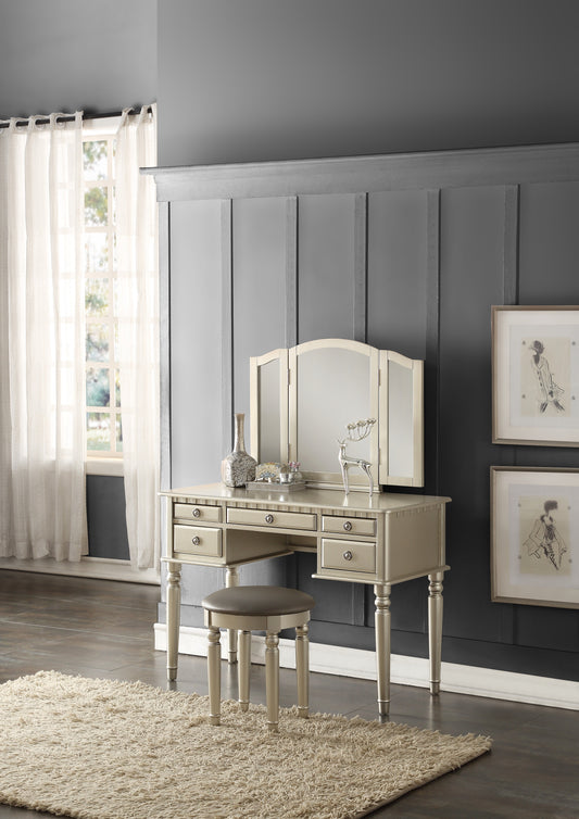 Champagne gold vanity table with trifold mirror and cushioned stool