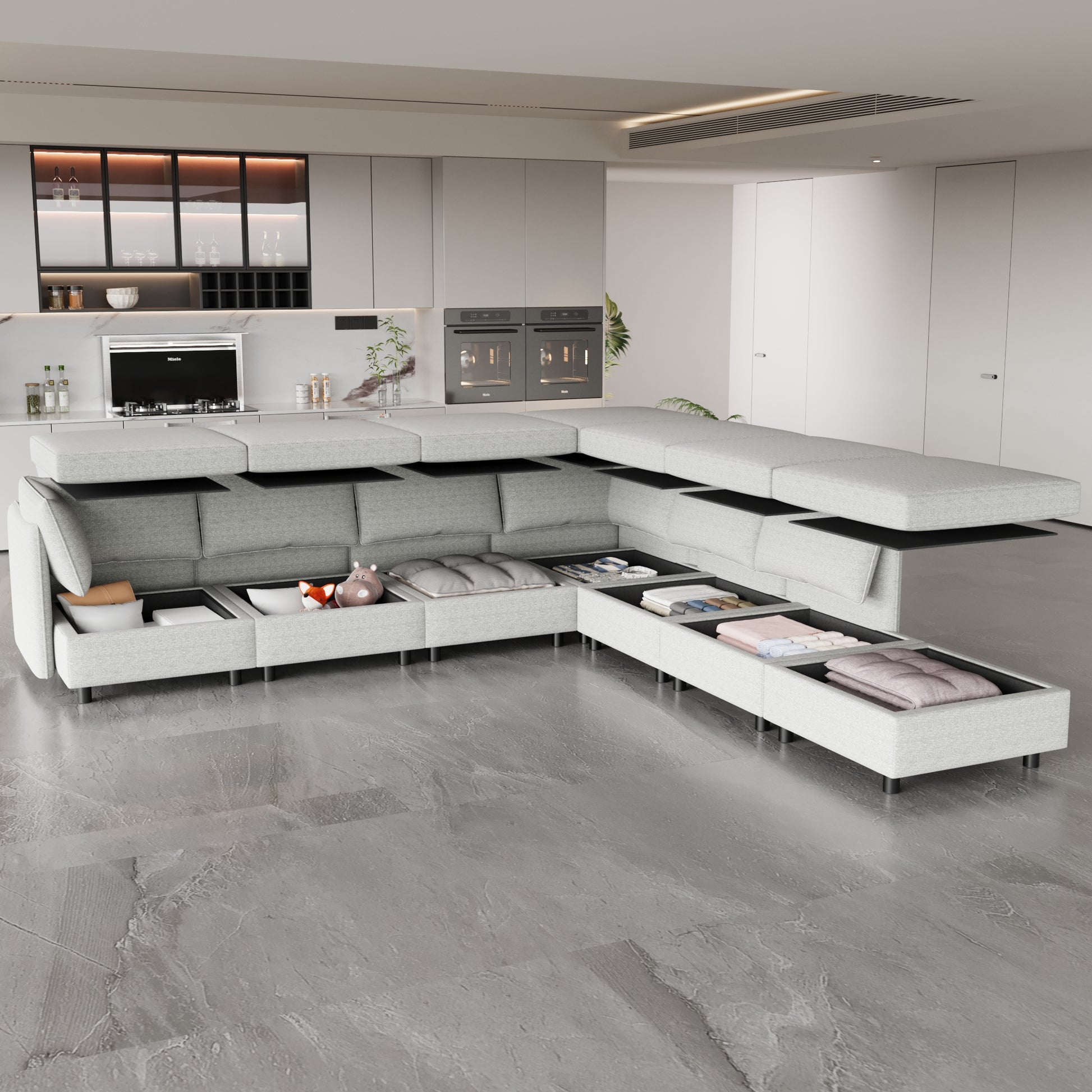 Light grey sectional sofa with open storage compartments showing blankets and pillows