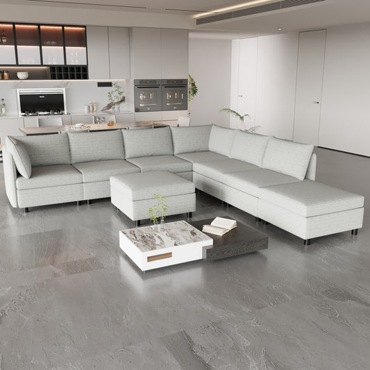 Light gray fabric sectional sofa with detached ottoman and modern coffee table