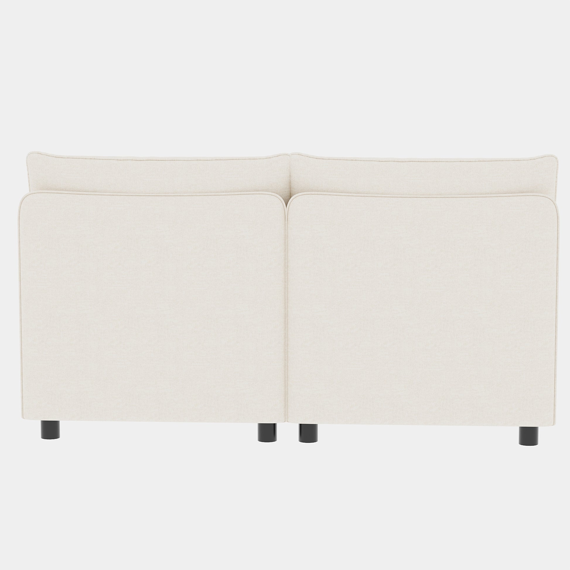 Cream upholstered sofa back with clean lines and black cylindrical legs