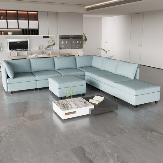 Light blue fabric sectional sofa with chaise and ottoman modern living room setup