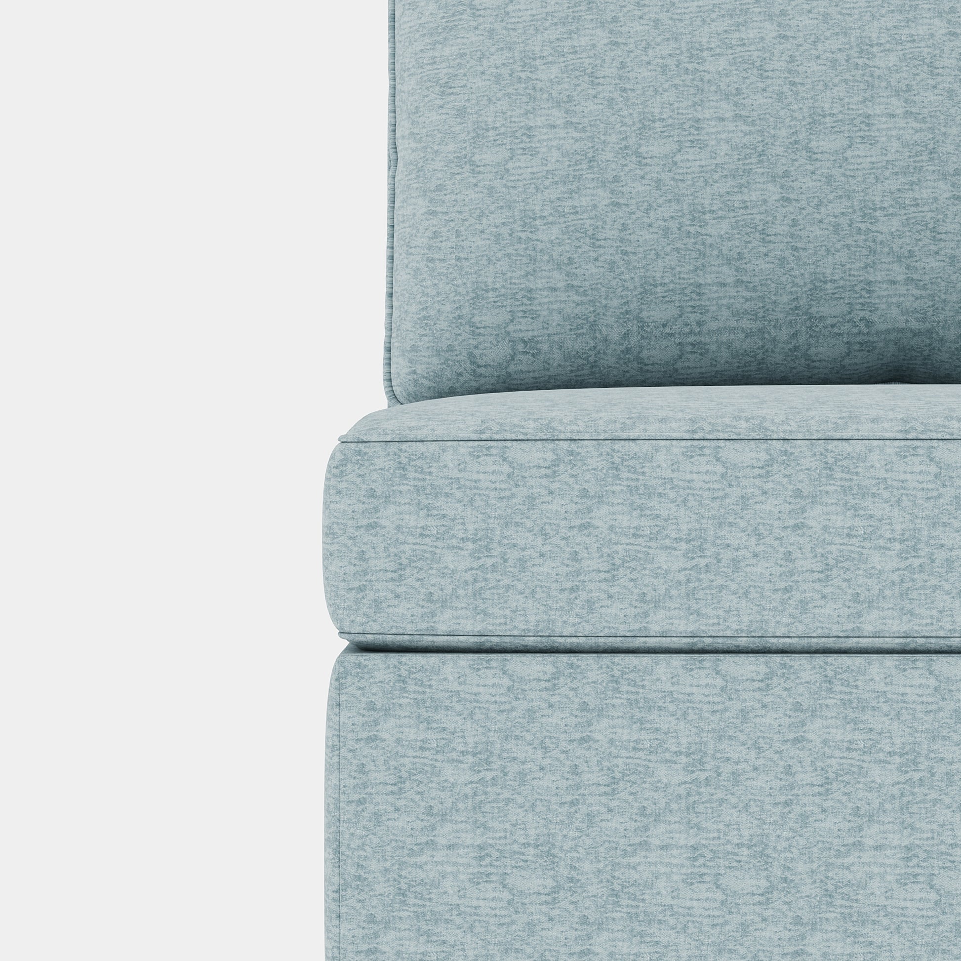 Closeup of a light blue textured fabric on a modern sofa cushion