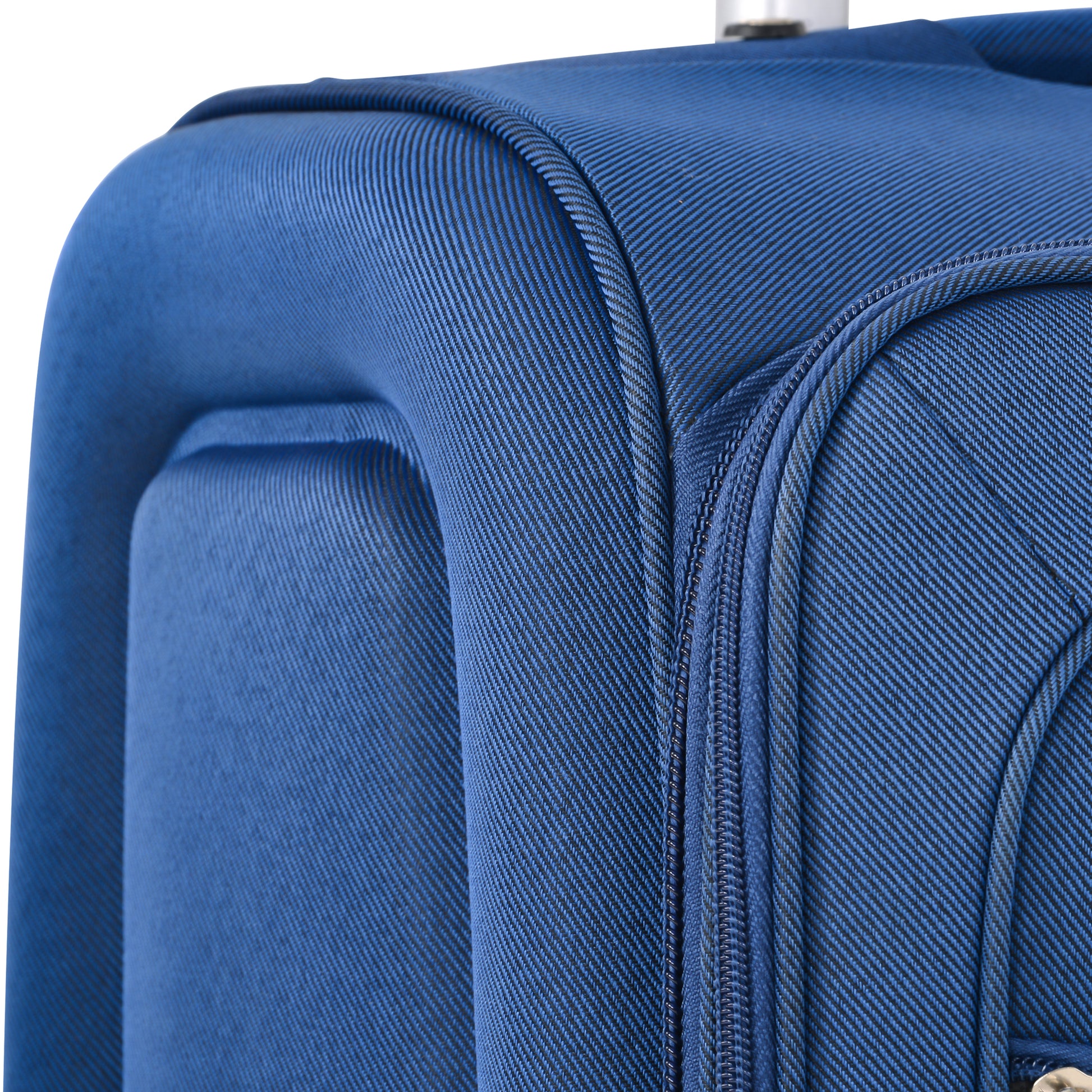 Closeup of blue textured fabric on a suitcase highlighting the weave pattern and zipper detail