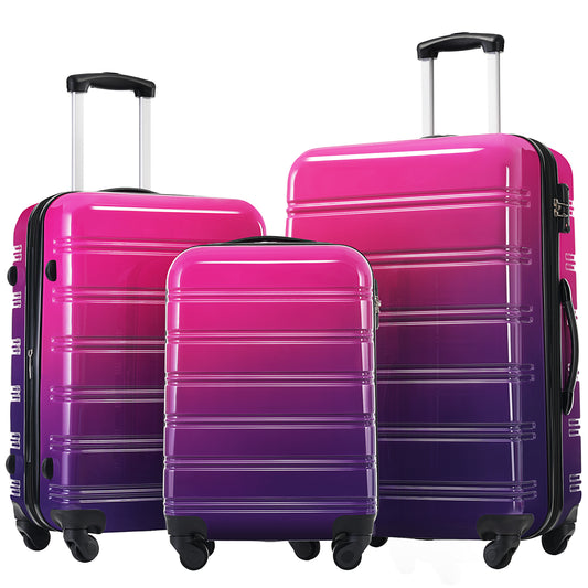 Set of three hardside suitcases in pink to purple gradient with retractable handles and spinner wheels