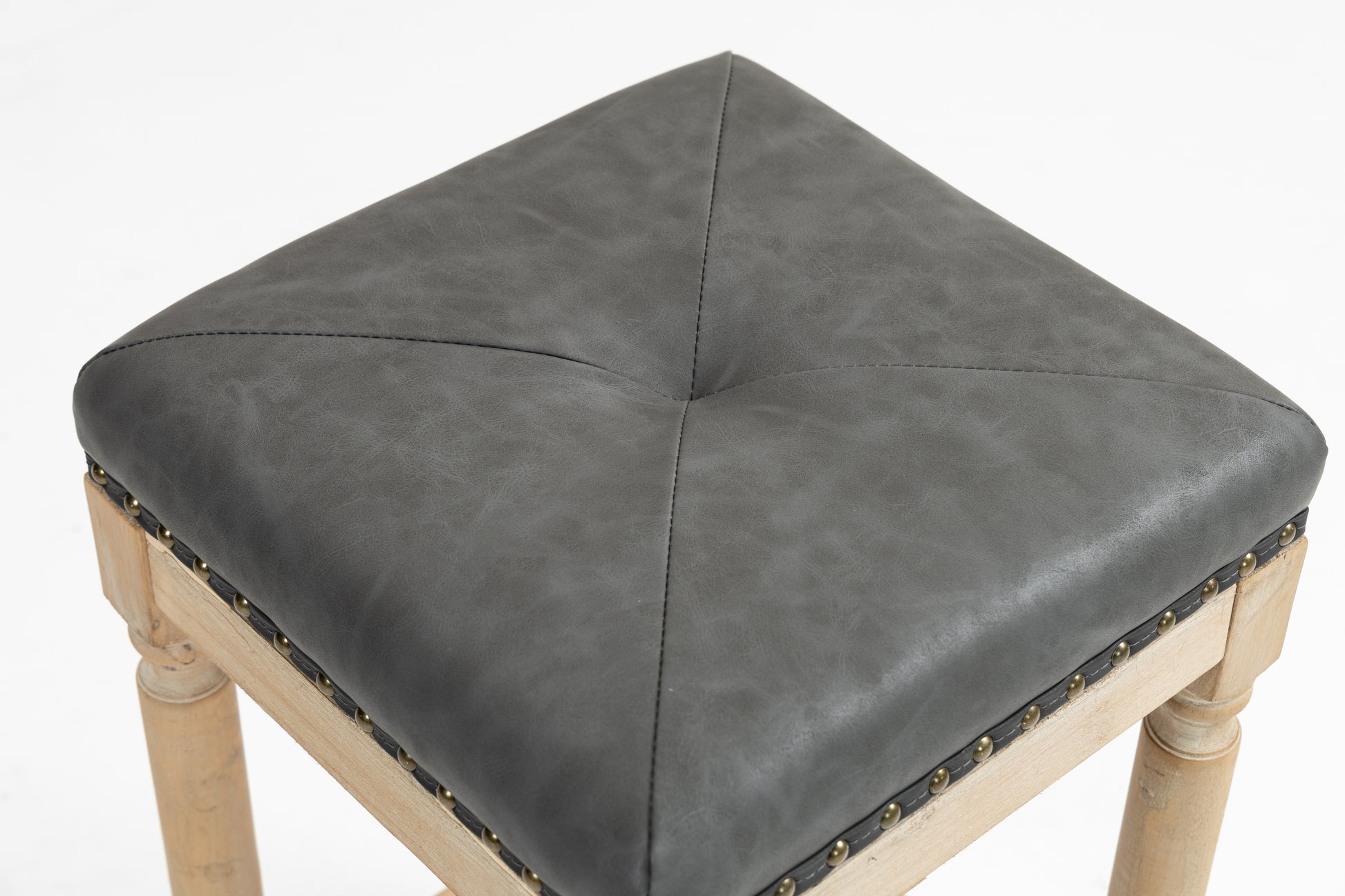 Grey faux leather square bar stool seat with diamond tufting and brass nailhead trim