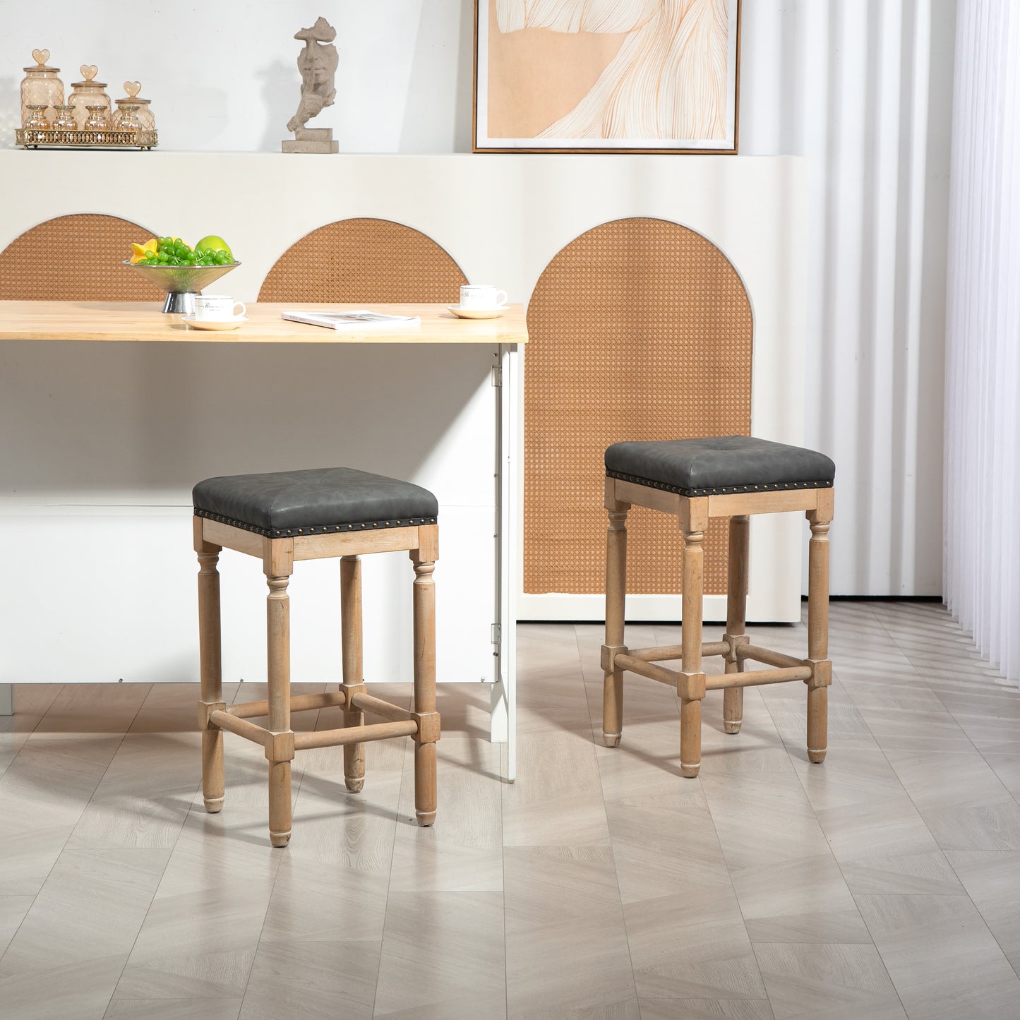 Grey faux leather bar stool with studded trim and natural wood legs