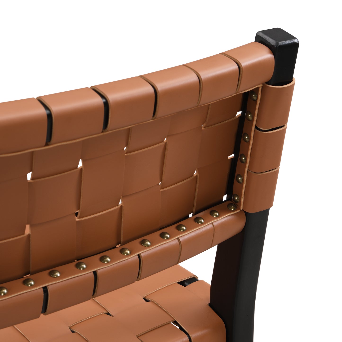 Tan woven leather chair back with brass stud detailing and black frame