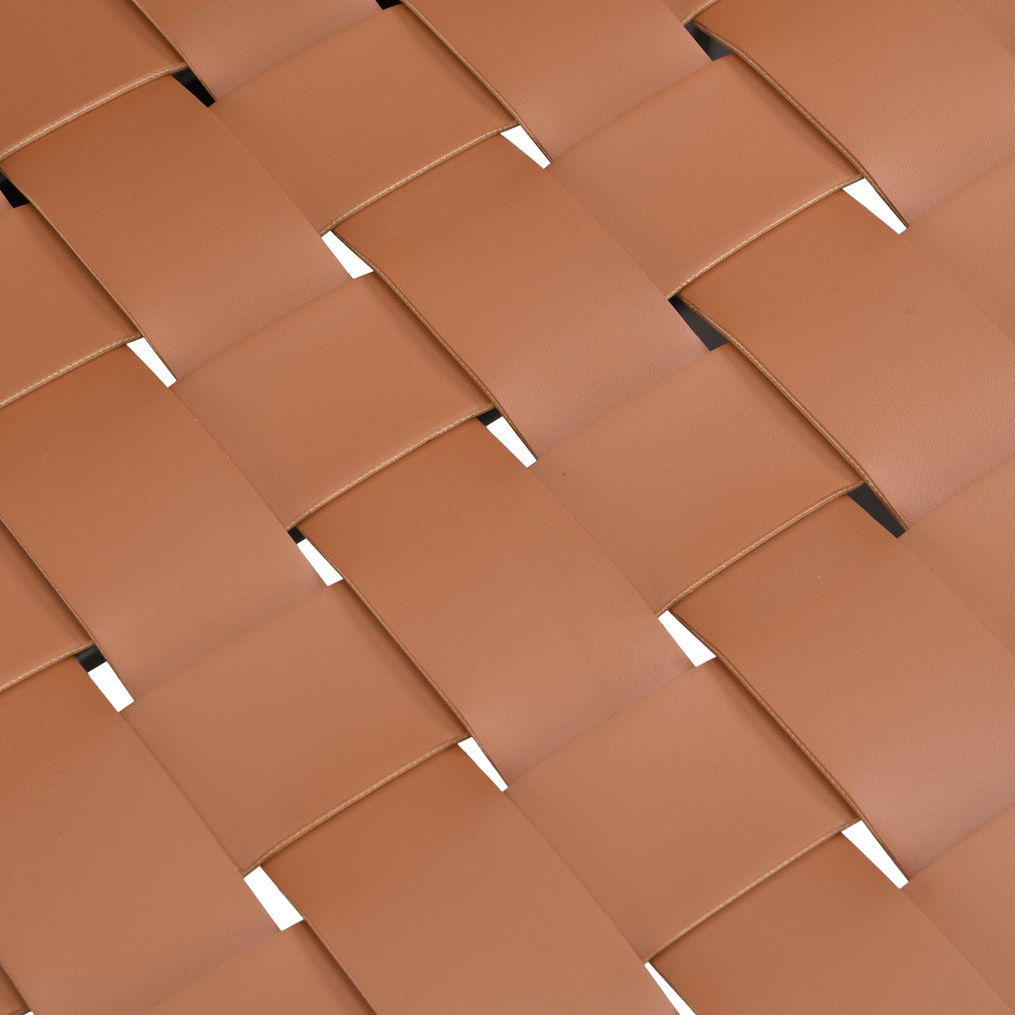 Closeup of brown woven leather straps with visible stitching ideal for premium handbags