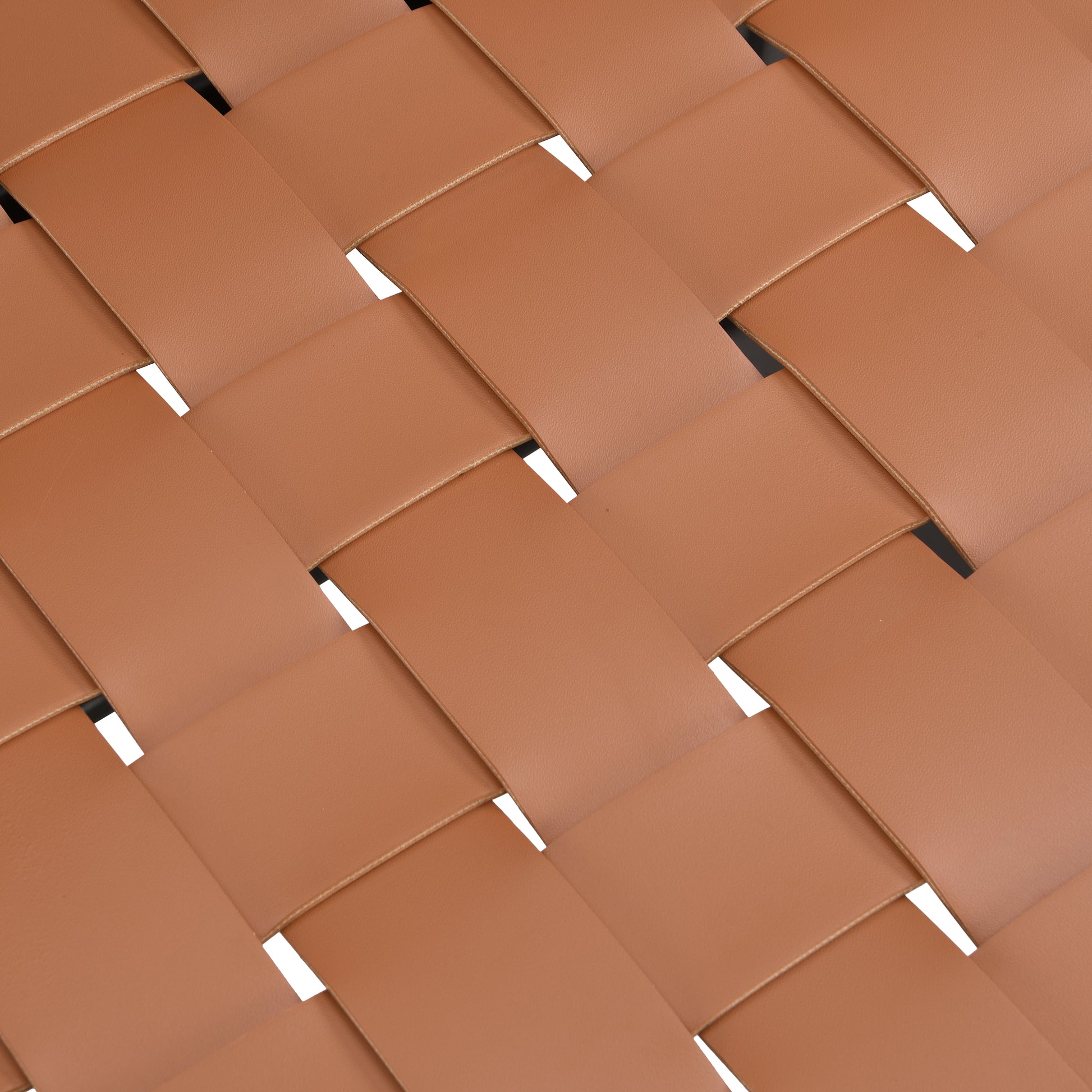 Closeup of brown woven leather straps with visible stitching ideal for premium handbags