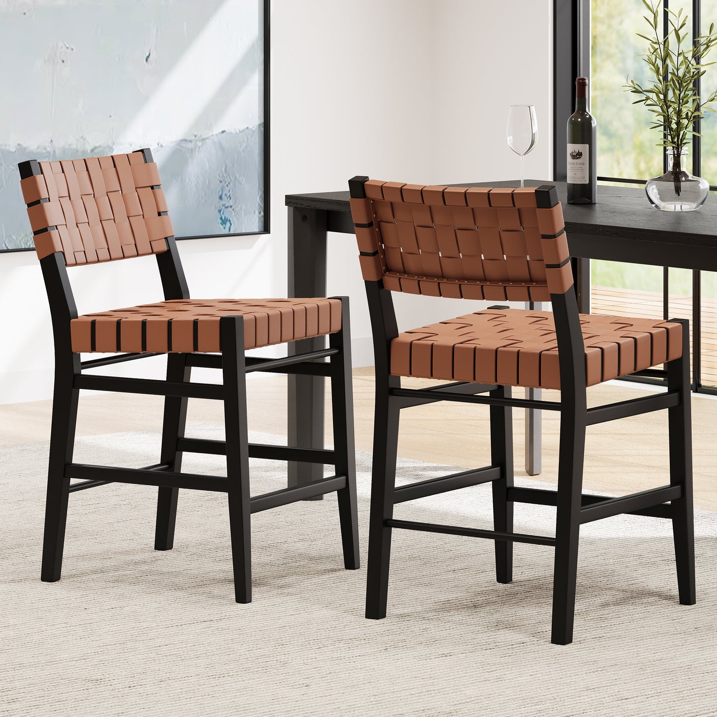 Two tan woven leather bar stools with black metal frames ideal for a modern kitchen island