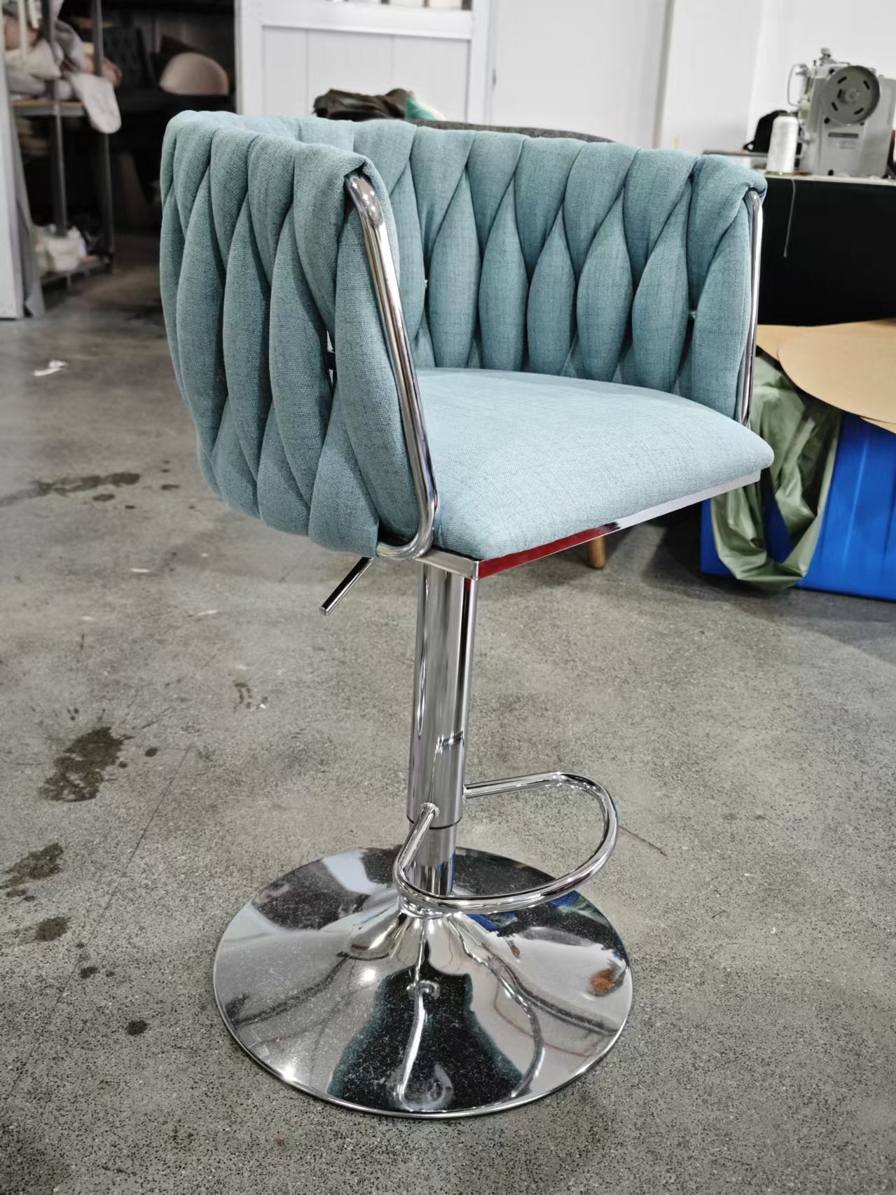 Light blue tufted back bar stool with chrome base and adjustable height