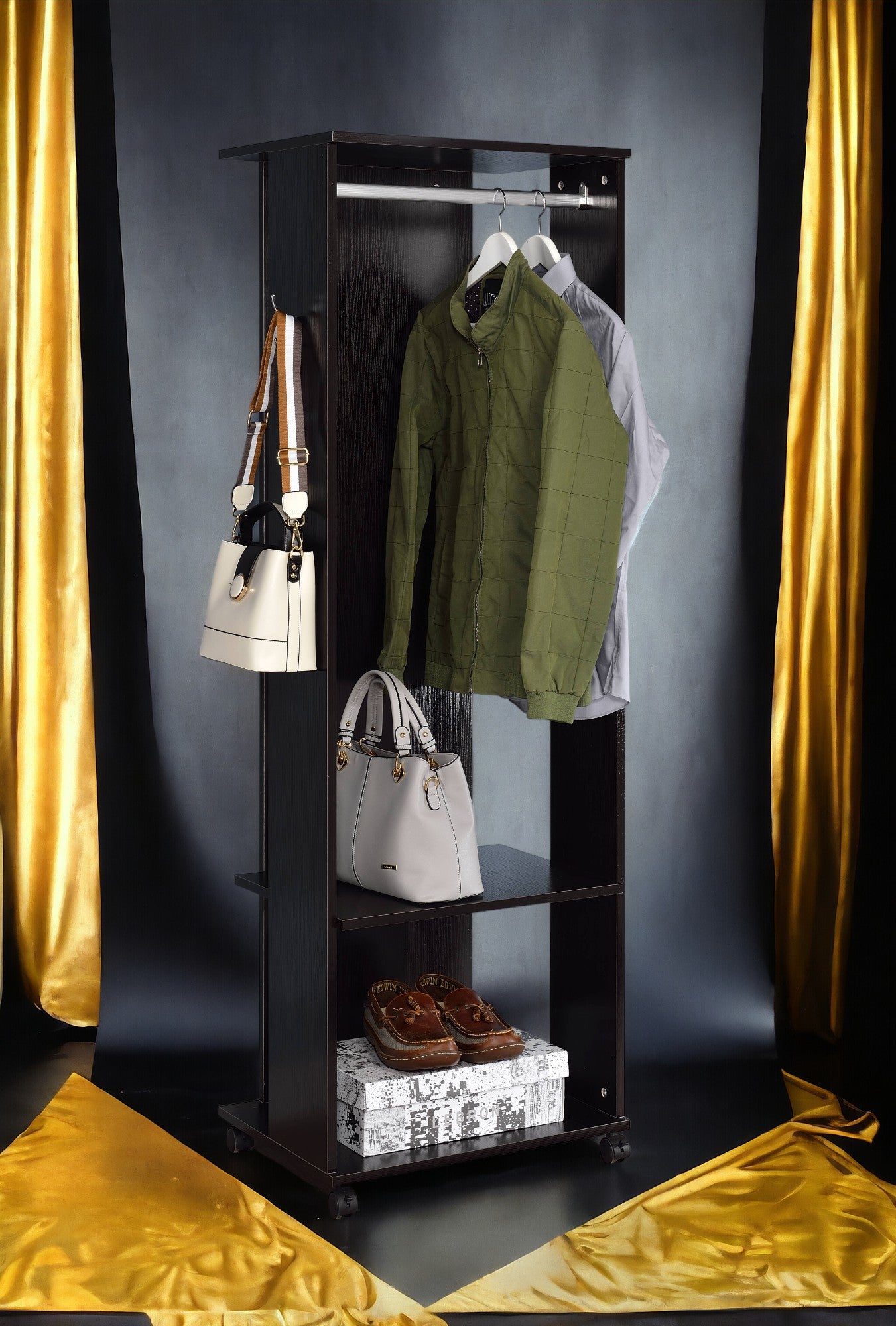 Dark brown garment rack displaying a green quilted jacket and a light gray dress shirt