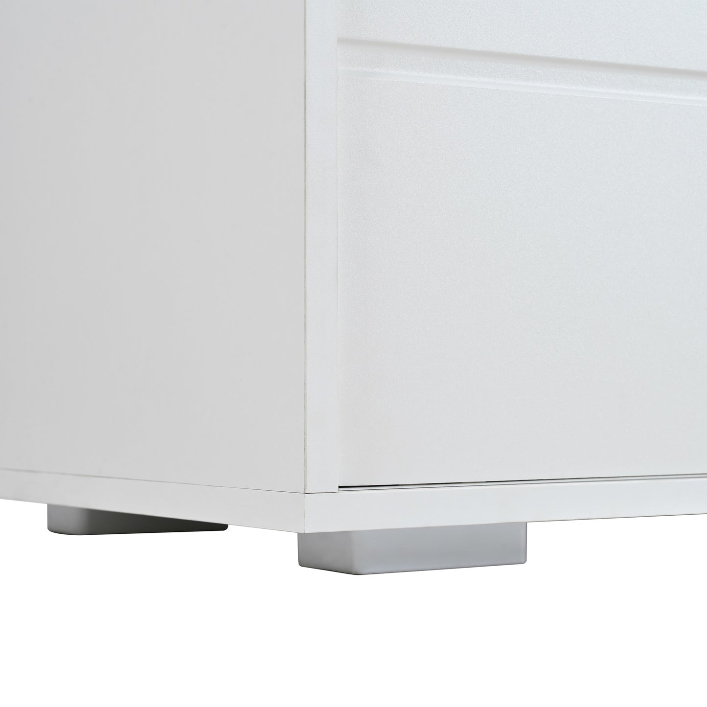 White minimalist dresser drawer detail with sleek metal feet