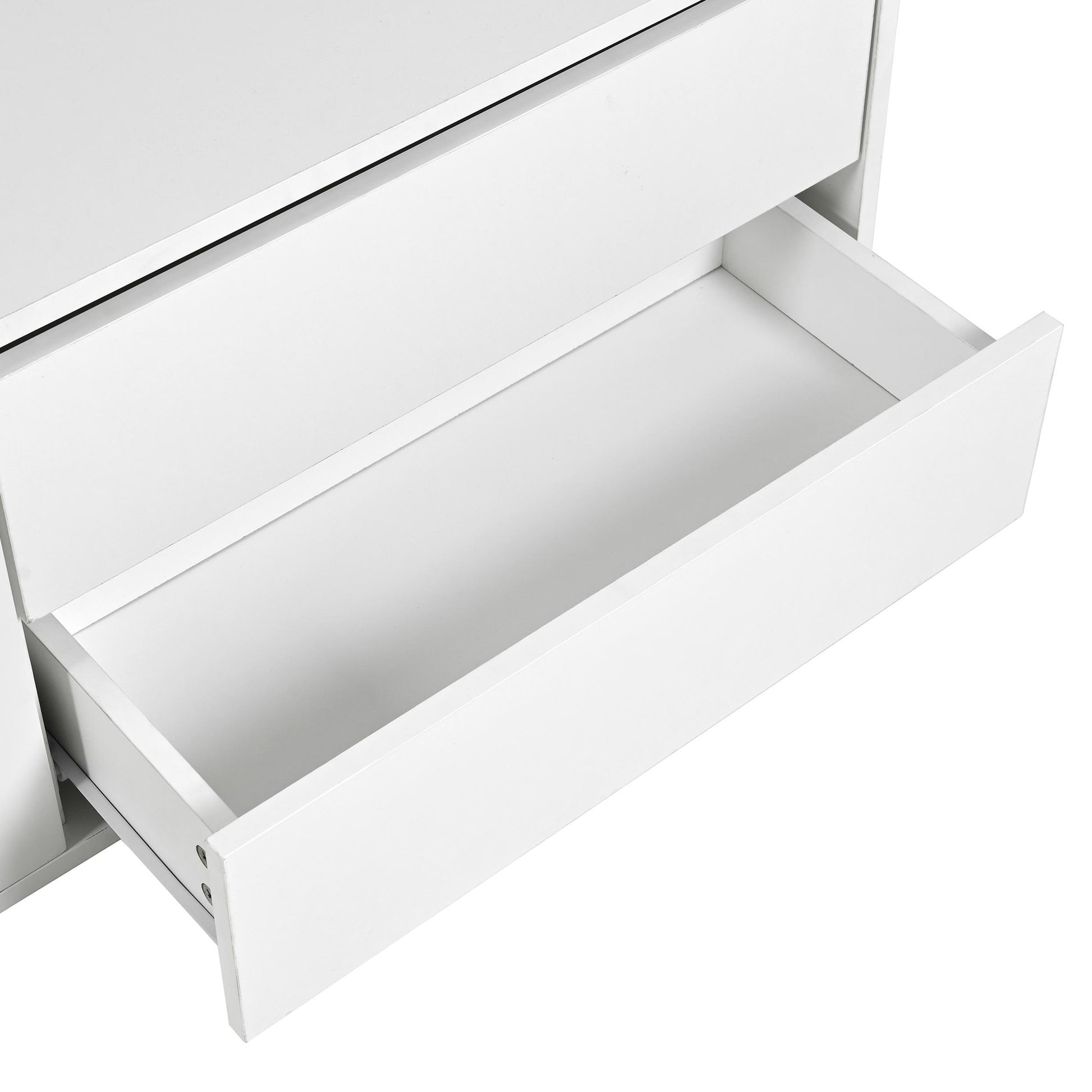 Open white dresser drawer showcasing smooth construction and metal drawer glides for easy access storage