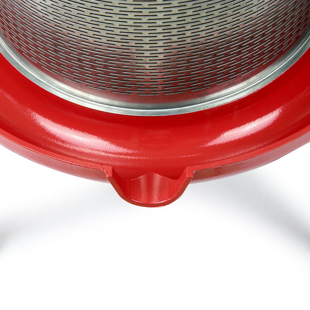 Red cast iron steamer basket with perforated metal and side spout