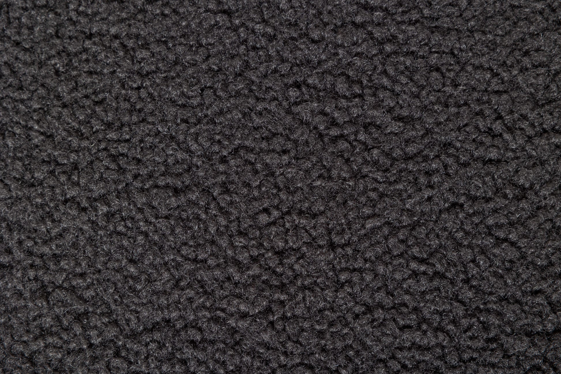 Closeup texture of dark grey fleece fabric soft and fluffy for winter apparel