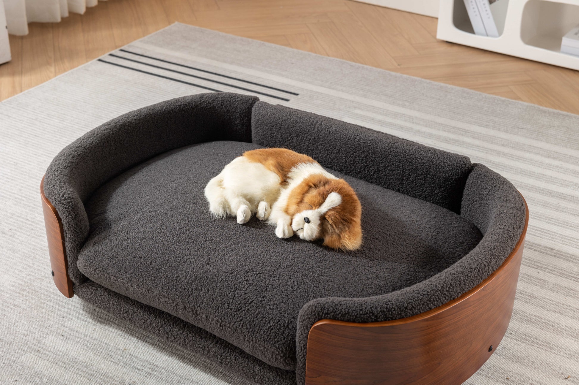 Plush grey pet bed with curved wooden frame featuring a soft cozy interior for ultimate pet comfort